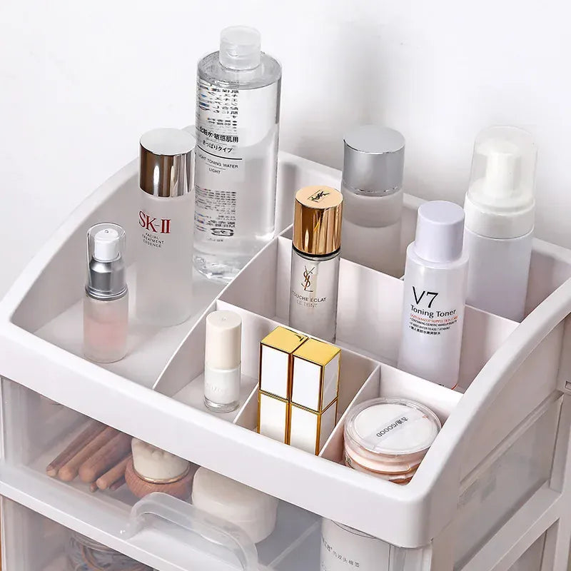 Top tray of clear organizer holding skincare and perfume bottles