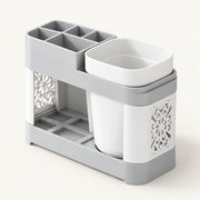 Grey and white toothbrush holder with rinse cup