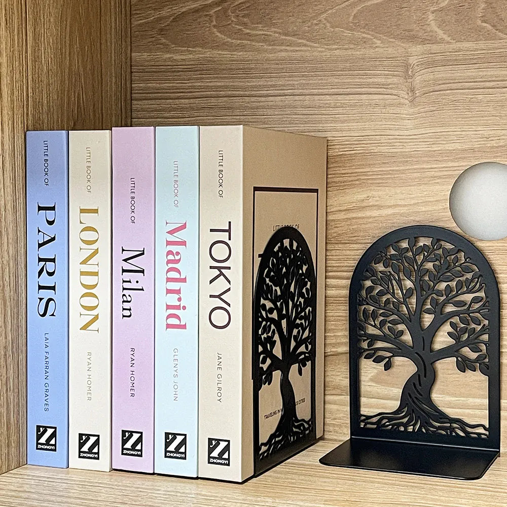 Tree of Life metal bookends supporting books on a wood surface