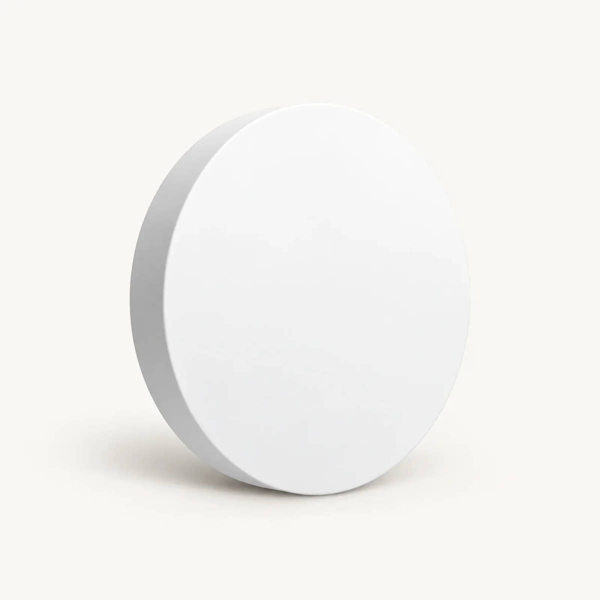 White round Tuya Zigbee scene button shown at an angle on a warm off-white background.