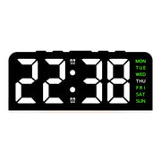 Black case digital alarm clock with white digits and green weekday labels