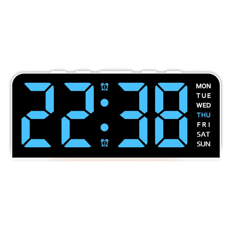 White case digital alarm clock with blue digits and white weekday labels