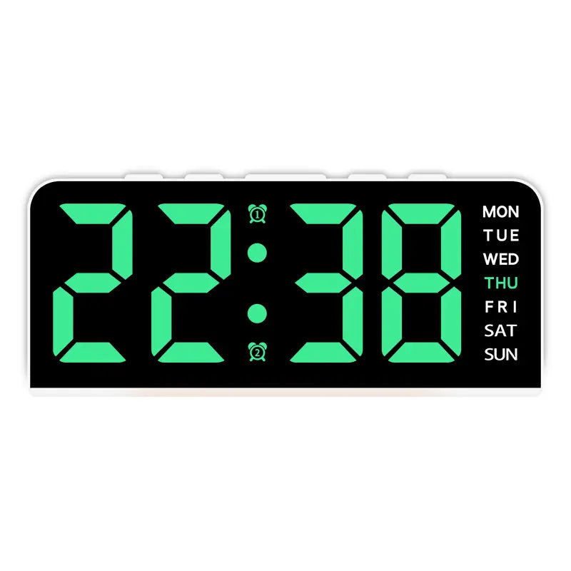 White case digital alarm clock with green digits and white weekday labels