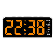 White case digital alarm clock with orange digits and white weekday labels