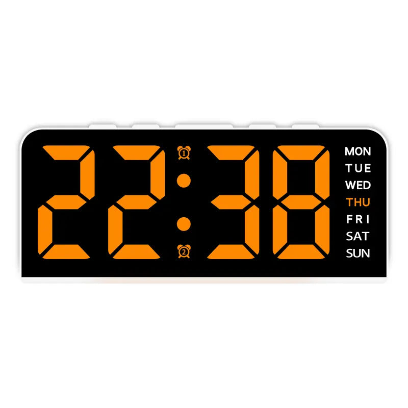 White case digital alarm clock with orange digits and white weekday labels