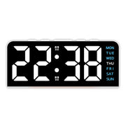 White case digital alarm clock with white digits and blue weekday labels