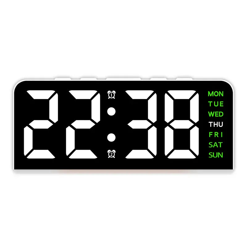 White case digital alarm clock with white digits and green weekday labels