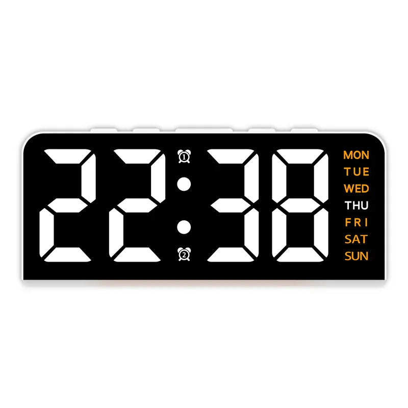 White case digital alarm clock with white digits and orange weekday labels