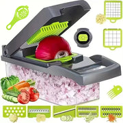 Vegetable chopper with interchangeable slicing, grating and dicing attachments