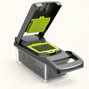 Grey and green vegetable chopper with container and draining basket on an off-white background with a soft natural shadow
