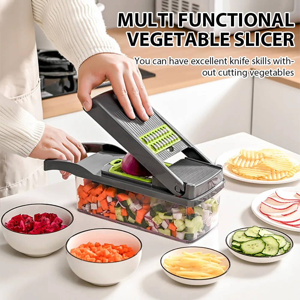 Grey and green vegetable chopper used on a kitchen counter with sliced and diced vegetables